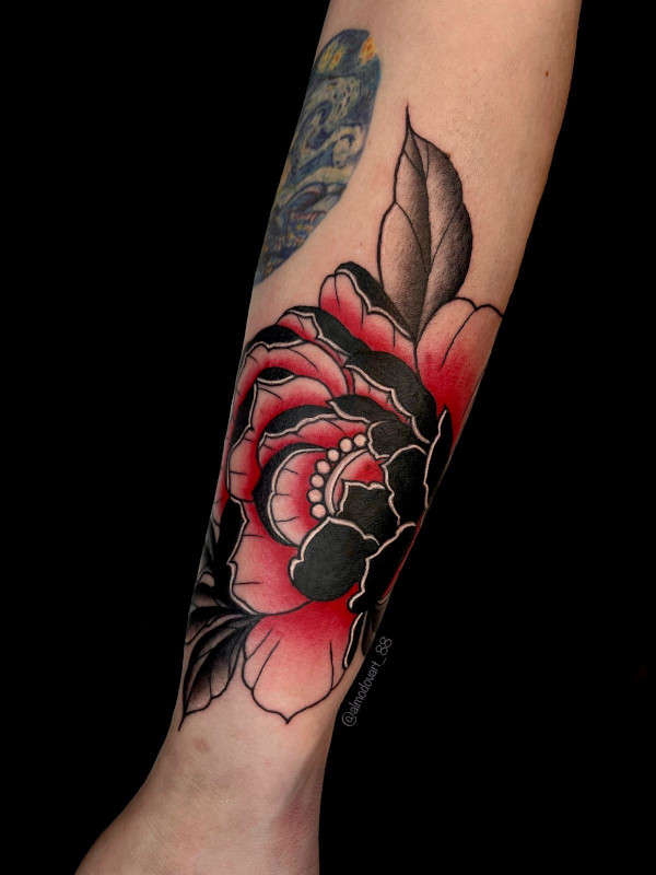 Black and Red peony forearm tattoo by tattoo artist Lita Almodovar of Sacred Mandala Studio in Durham, NC.